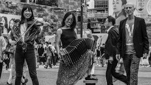 A photo of two women holding instruments