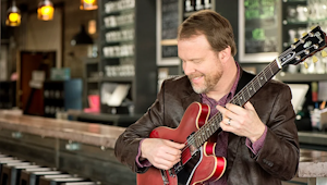 A man playing guitar