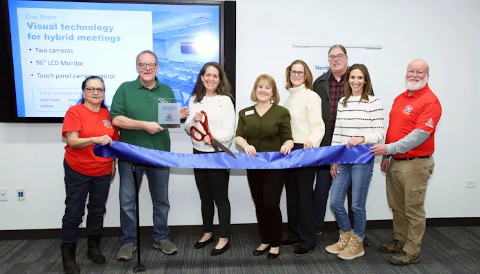 Members of the Northbrook Civic Foundation and Library Board at a ribbon cutting ceremony